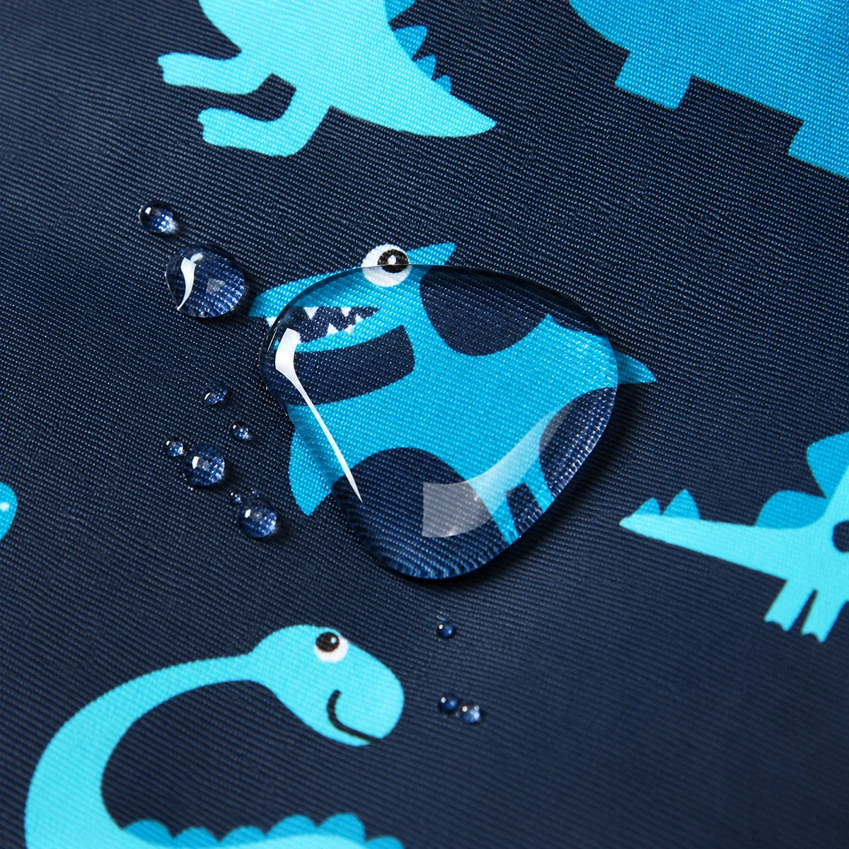 Water drops beading on HONEYKING dinosaur print snowsuit fabric