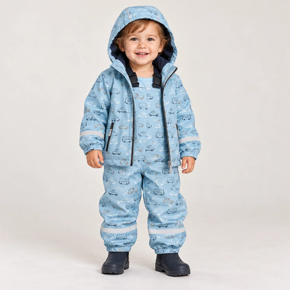 Toddler wearing HONEYKING fleece-lined rain jacket and bib rain pants in light blue car print with rain boots