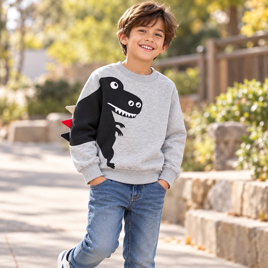 Boy wearing grey kids’ dinosaur sweatshirt with T-rex print and 3D spikes