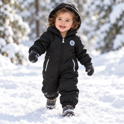 Toddler wearing Classic Black hooded windproof jumpsuit outdoors